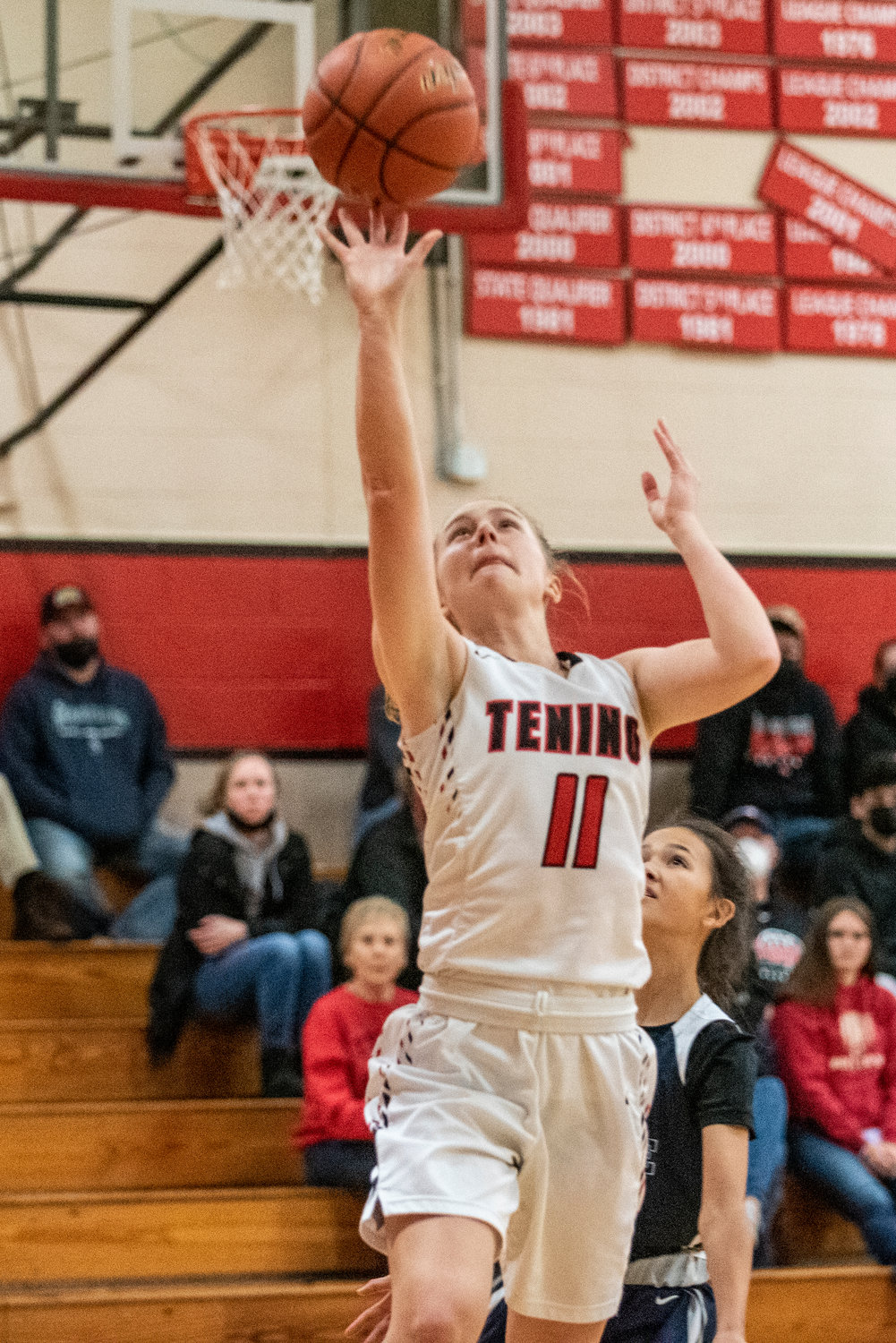 Tenino's Megan Letts (11) gets a wide-open layup against Cascade Christian on Dec. 20.